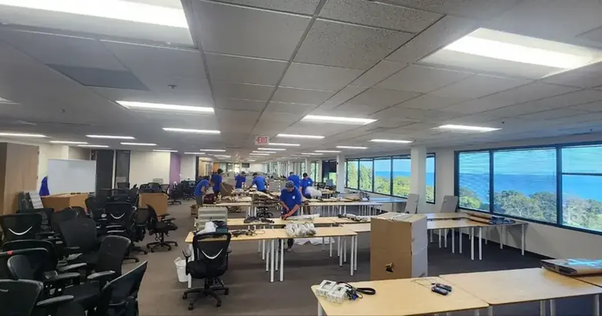 Movers working through a commercial space during a business relocation